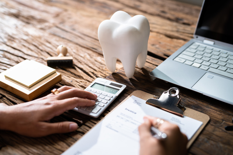 A patient looking at a dental insurance form